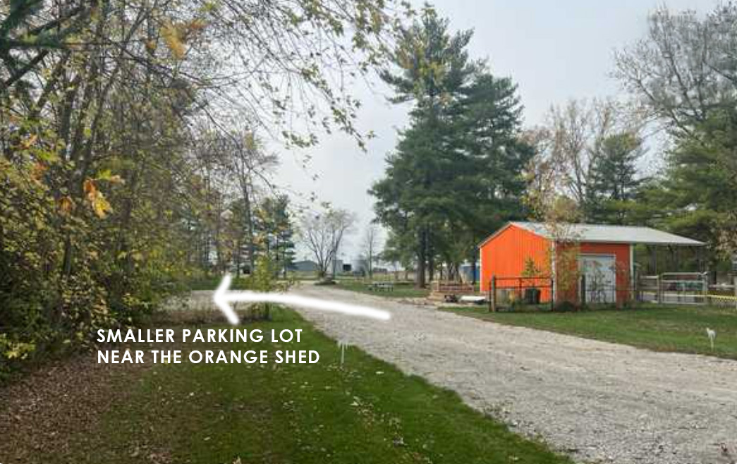 Field parking near the orange shed